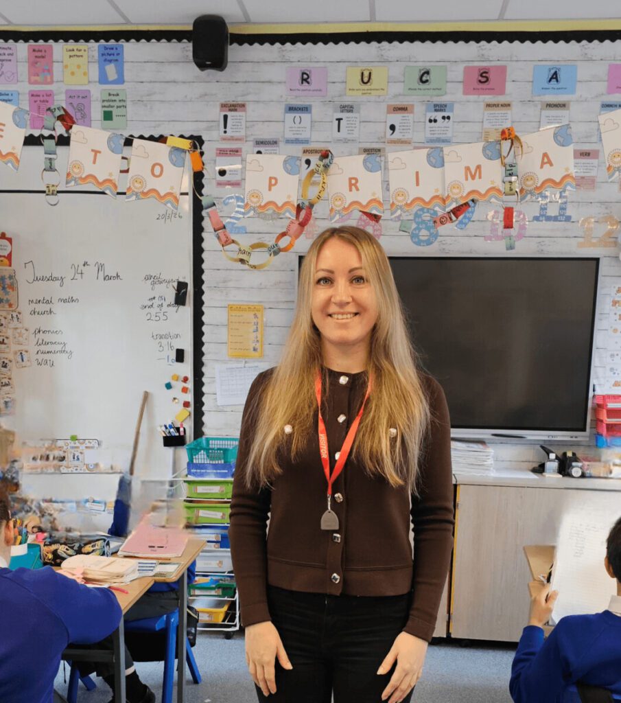 Employment Academy Ards North Down. Liudmyla in a classroom at St Mary’s Primary School in Comber, working as a classroom assistant after training with People 1st