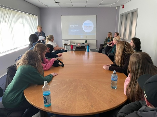 People 1st Lurgan students gathered around a table during a careers and employability session at the Job and Benefits Office.